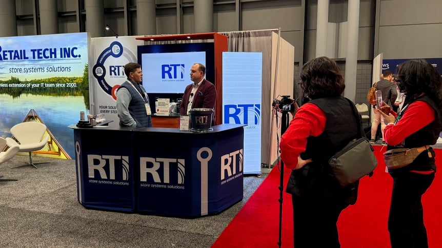 RTI team member having a interview at NRF Retail's Big Show being recorded and photographed