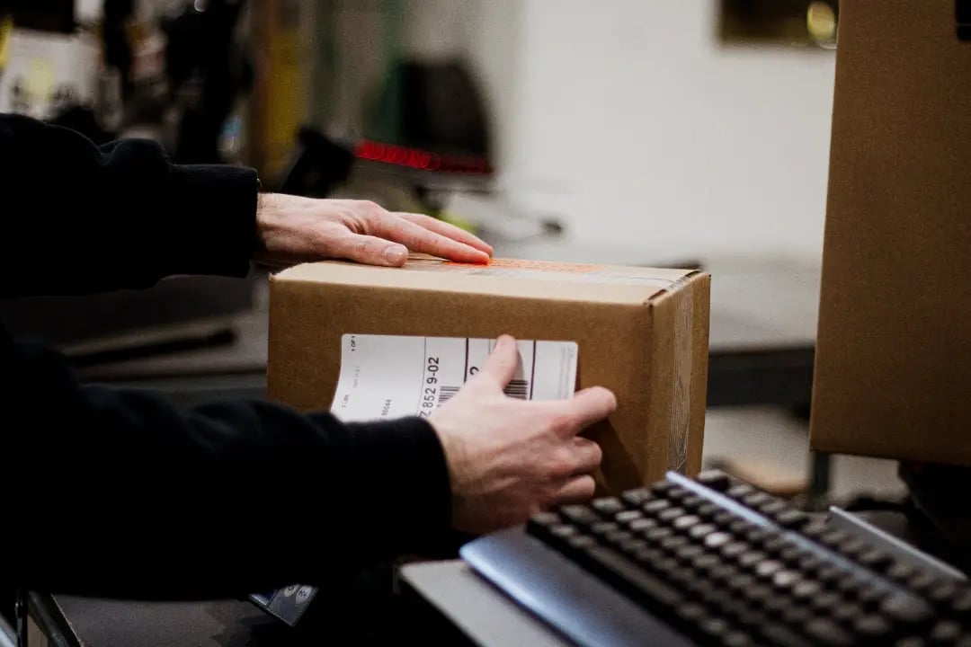 A label being put on a shipment box
