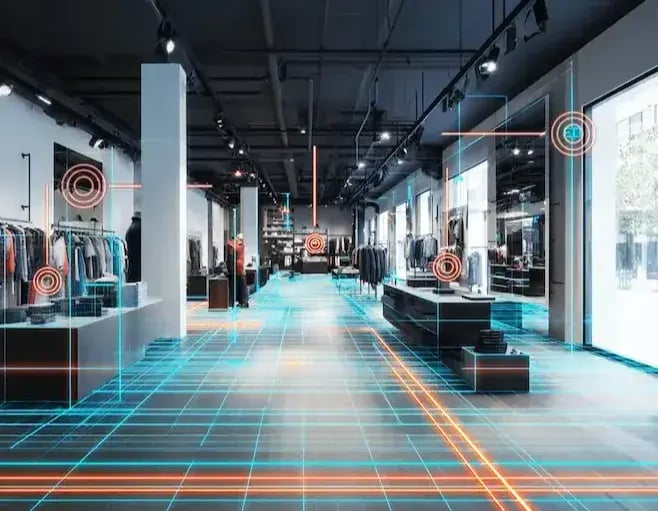 Interior of a modern retail clothing store with digital overlay showing cyan grid lines on the floor and orange target icons marking key areas for tracking