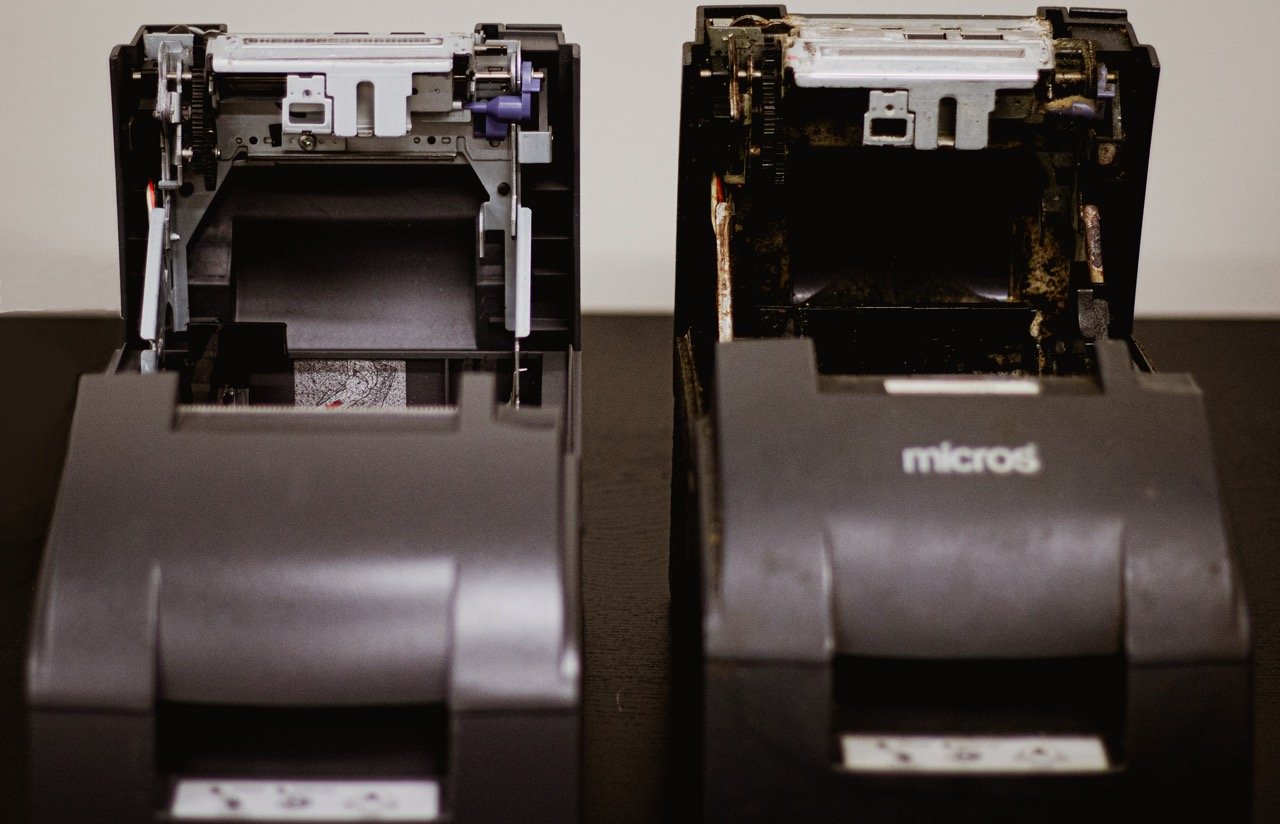 close up of retail technology POS printers before and after tune up maintenance